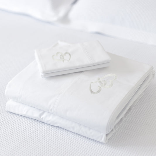 white egyptian 1000 thread count sheets with a double heart embroidery