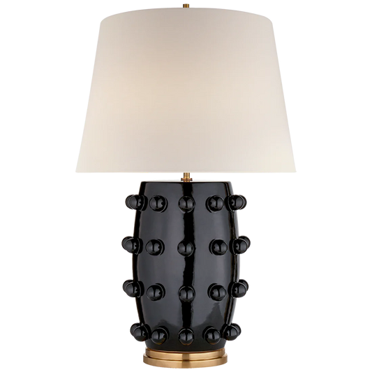 Linden Table Lamp by Kelly Wearstler, black base covered in small spheres and finished with a large cream linen shade