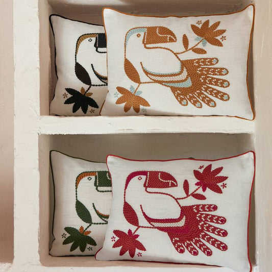 4 linen cushions in plain linen featuring embroidere toucans