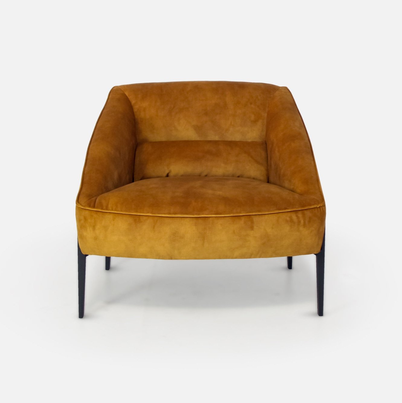 Gold velvet curvaceous arm chair with black legs
