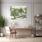 Tropical art print with peacocks and ferns hanging about a pale wooden modern desk and cream chair surrounded by a modern black and pale wood book case and potted ferns. Against a grey paneled wall with light wooden floorboards on the floor
