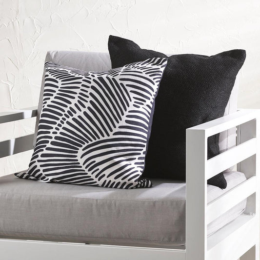 Contours cushion in black and white hand drawn lines on a white and grey outdoor chair with a black cushion