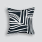 The Maze cushion is black with hand drawn squiggly lines in white