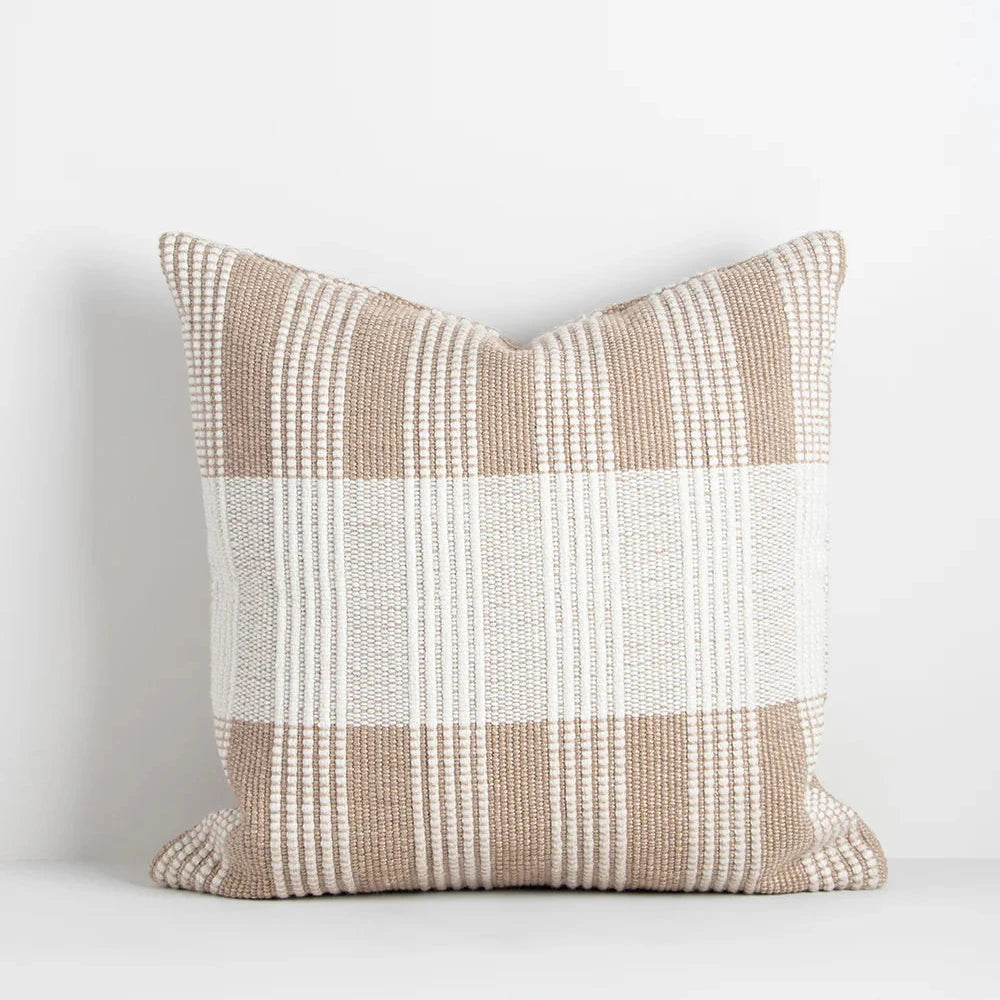 Two tone cushion with a linear pattern in almond and cumin