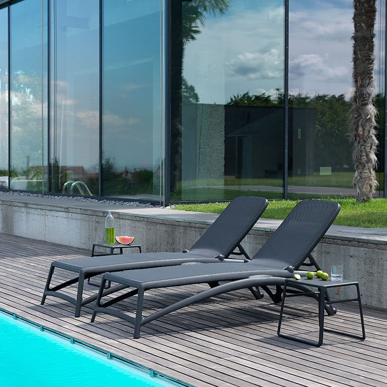 Atlantico sun lounger in charcoal by the pool, Nardi outdoor furniture